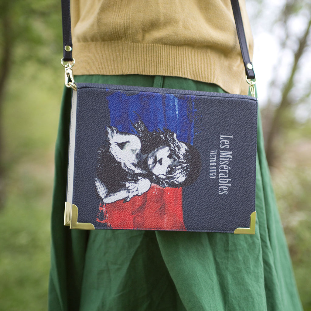 Les Misérables Book Handbag by Victor Hugo featuring Cosette over French flag design, by Well Read Co. - Model Standing