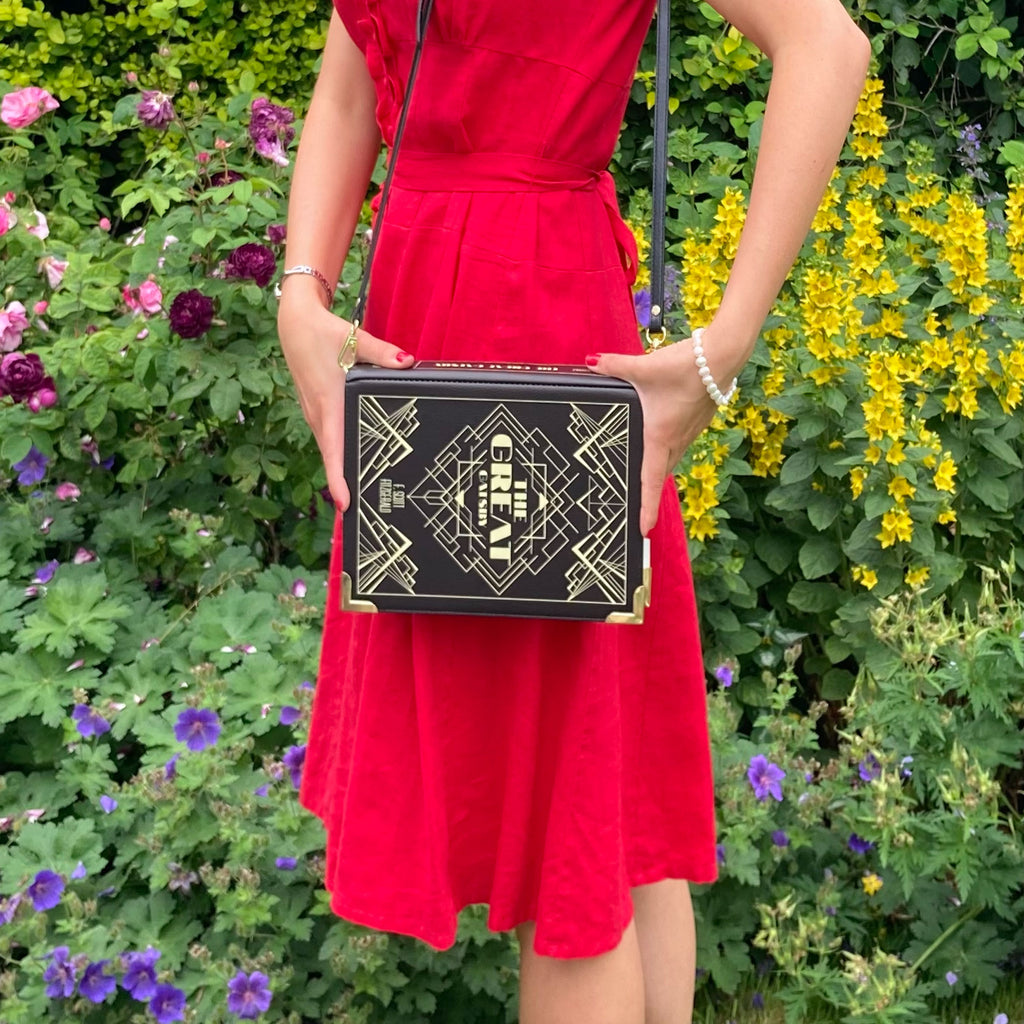The Great Gatsby Black and Gold Handbag by F. Scott Fitzgerald featuring Art Deco design, by Well Read Co. - Model Standing