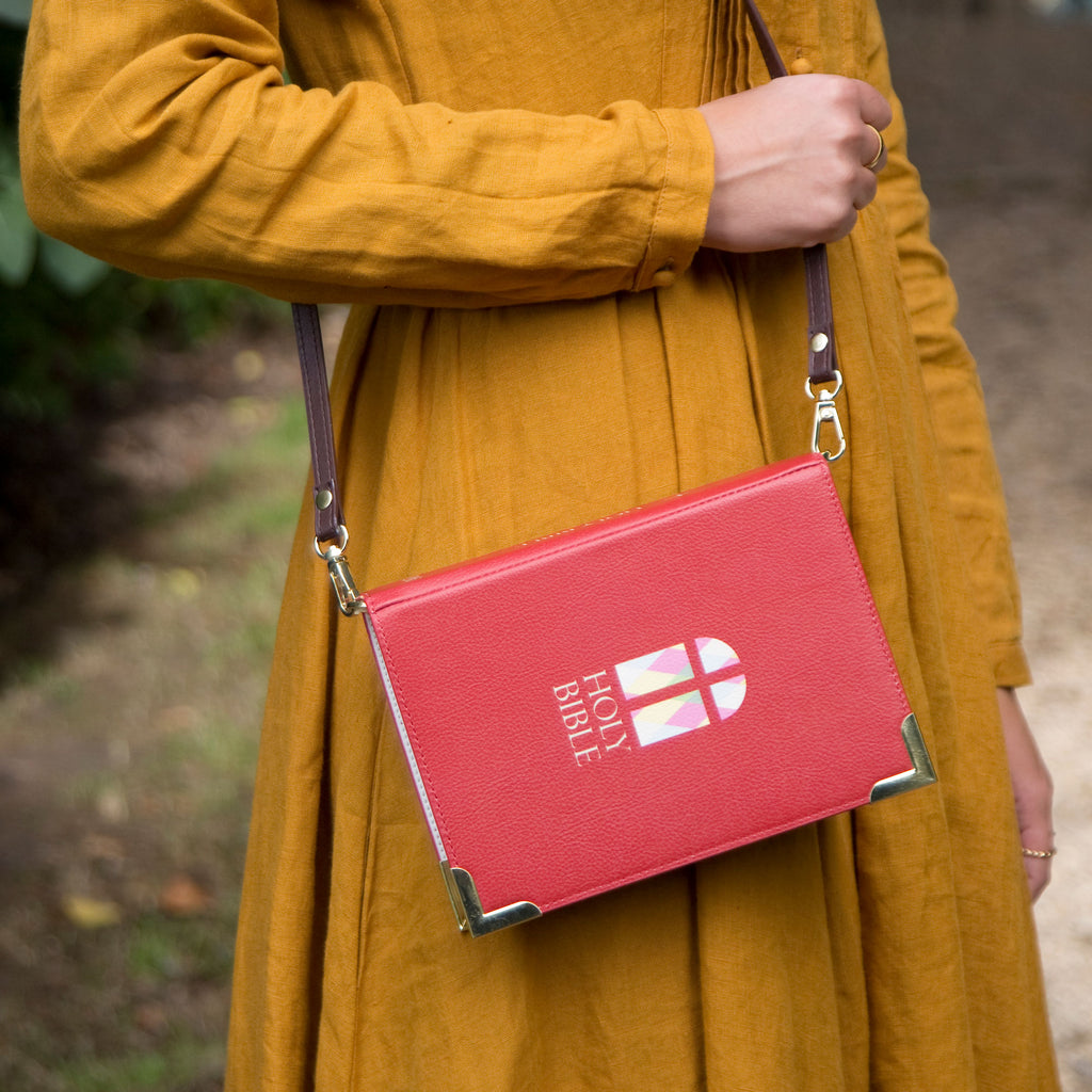 The Holy Bible Red Handbag by Well Read Co. featuring Stained-Glass Window design - Model Standing