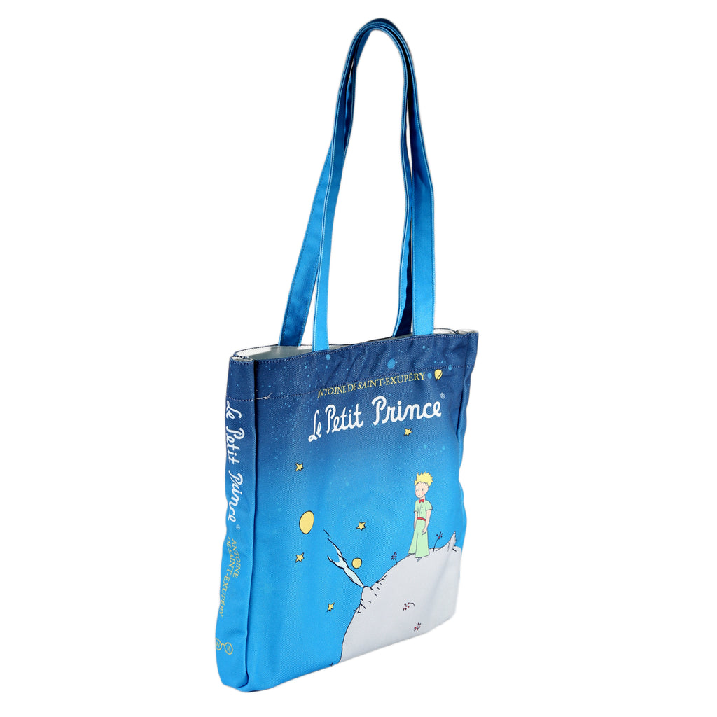 The Little Prince Blue Tote Bag by Antoine de Saint-Exupéry featuring Little Prince on his Home Planet design, by Well Read Co. - Side