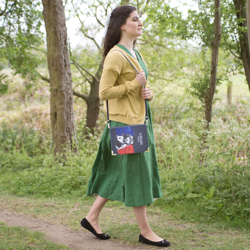 Les Misérables Book Handbag by Victor Hugo featuring Cosette over French flag design, by Well Read Co. - Model in Green
