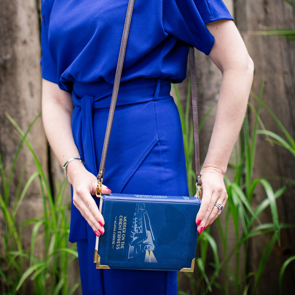 The Murder on the Orient Express Blue Handbag by Agatha Christie featuring Steam Train design, by Well Read Co. - Model Standing