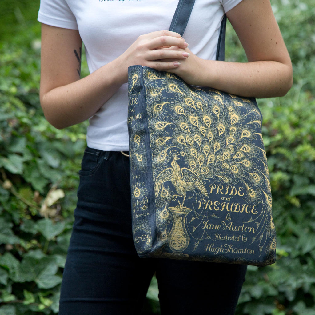 Pride and Prejudice Polyester Tote Bag by Jane Austen with Gold Peacock design, by Well Read Co. - Model Standing with Bag