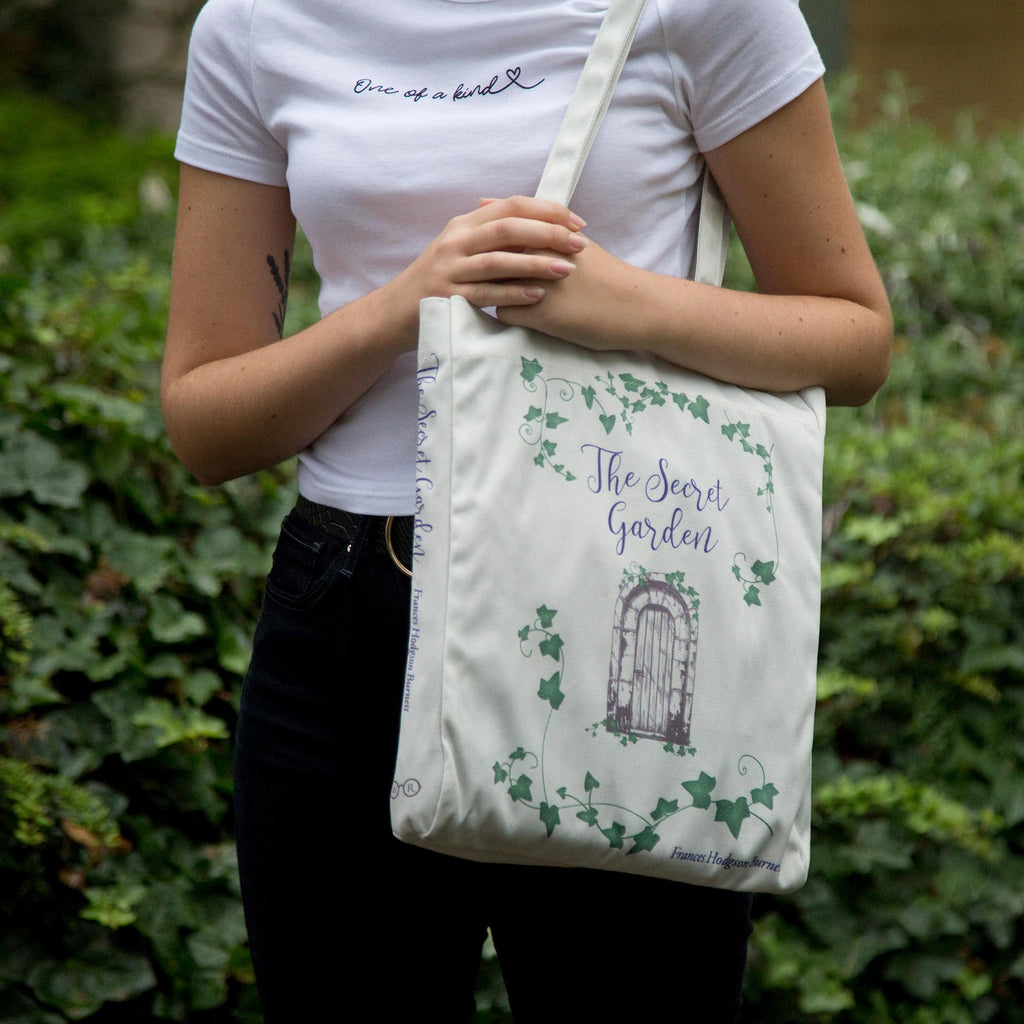 The Secret Garden Grey Tote Bag by F.H. Burnett featuring Gate and Ivy design, by Well Read Co.  - Model with bag