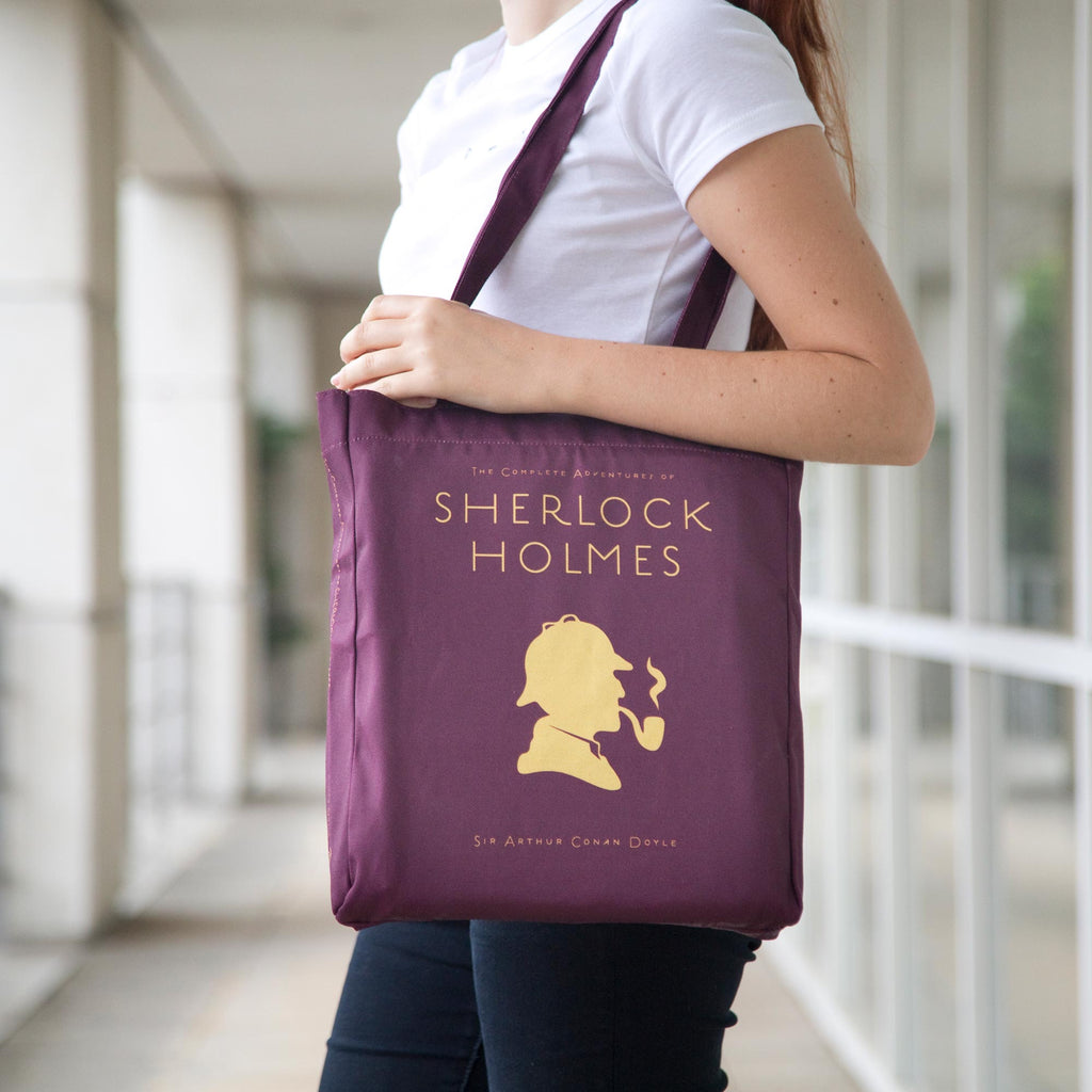 Sherlock Holmes Burgundy Tote Bag by Arthur Conan Doyle featuring Sherlock Holmes Silhouette design, by Well Read Co.  - Girl Standing with Bag