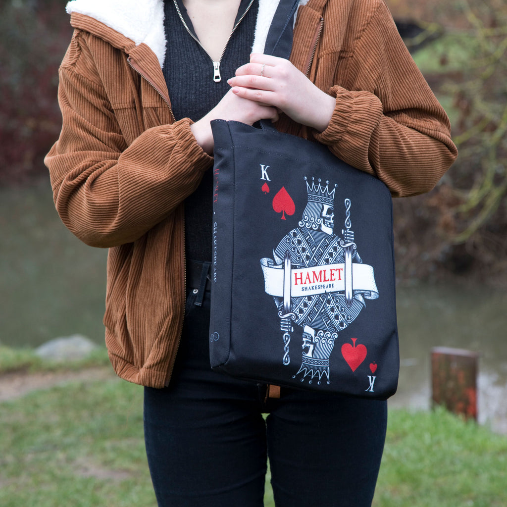Hamlet Black Tote Bag by William Shakespeare featuring Playing Card and Skull design, by Well Read Co. - Model