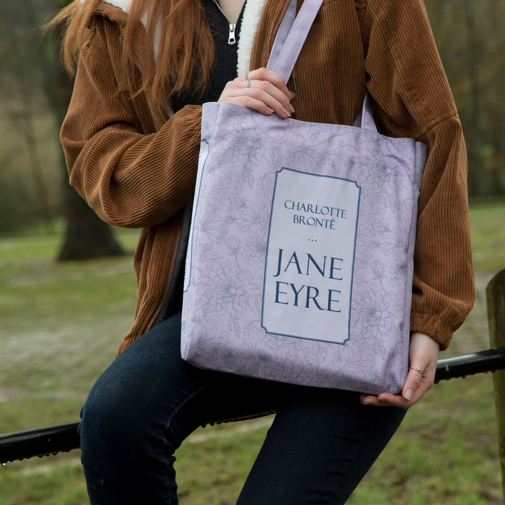 Jane Eyre Lilac Tote Bag by Charlotte Brontë featuring Floral design, by Well Read Co. - Model Sitting
