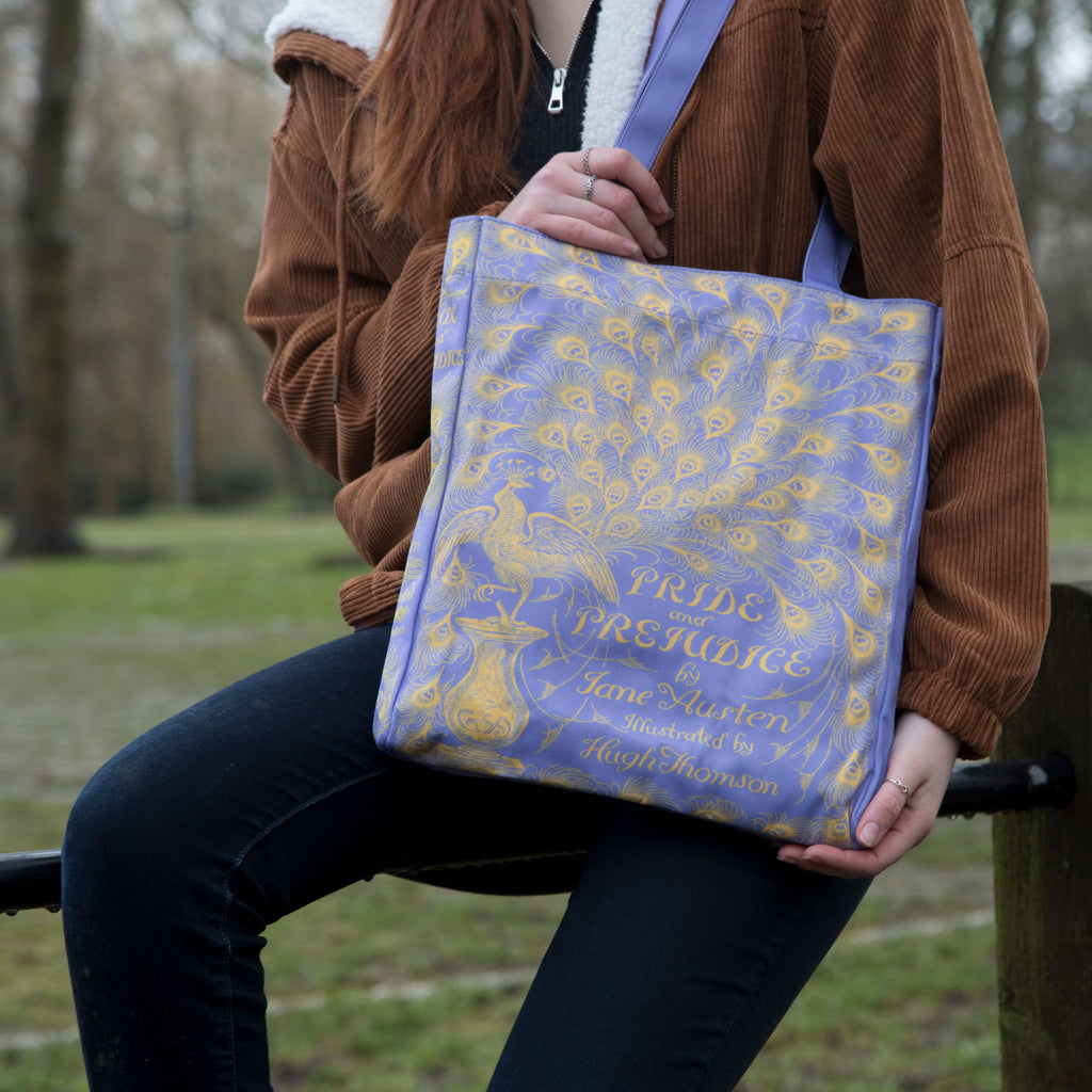 Pride and Prejudice Purple Tote Bag by Jane Austen with Peacock design, by Well Read Co. - Model Sitting with Bag